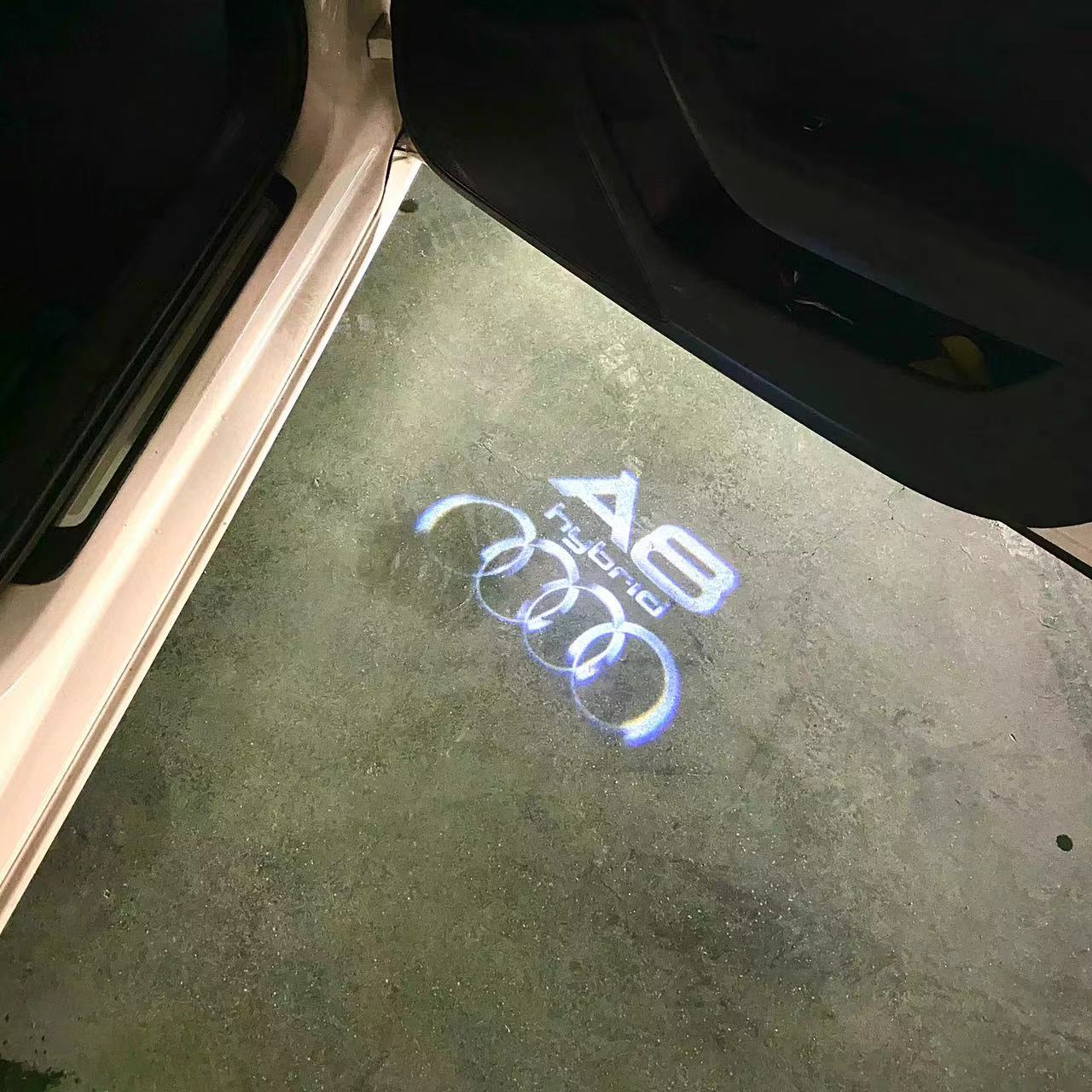AUDI LOGO PROJECTOT LIGHTS Nr.46 (الكمية 1 = 2 Logo Films /2 أضواء الباب)