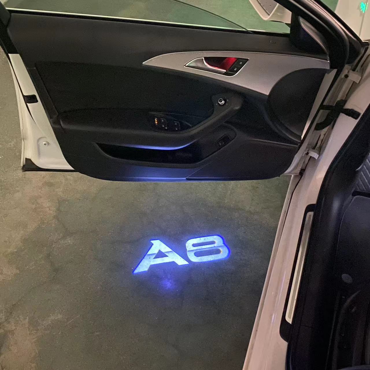 AUDI LOGO PROJECTOT LIGHTS Nr.46 (الكمية 1 = 2 Logo Films /2 أضواء الباب)