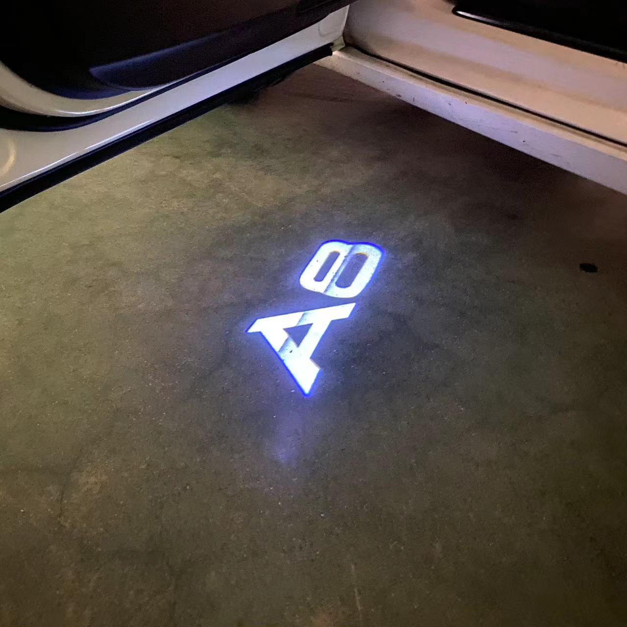 AUDI LOGO PROJECTOT LIGHTS Nr.46 (الكمية 1 = 2 Logo Films /2 أضواء الباب)