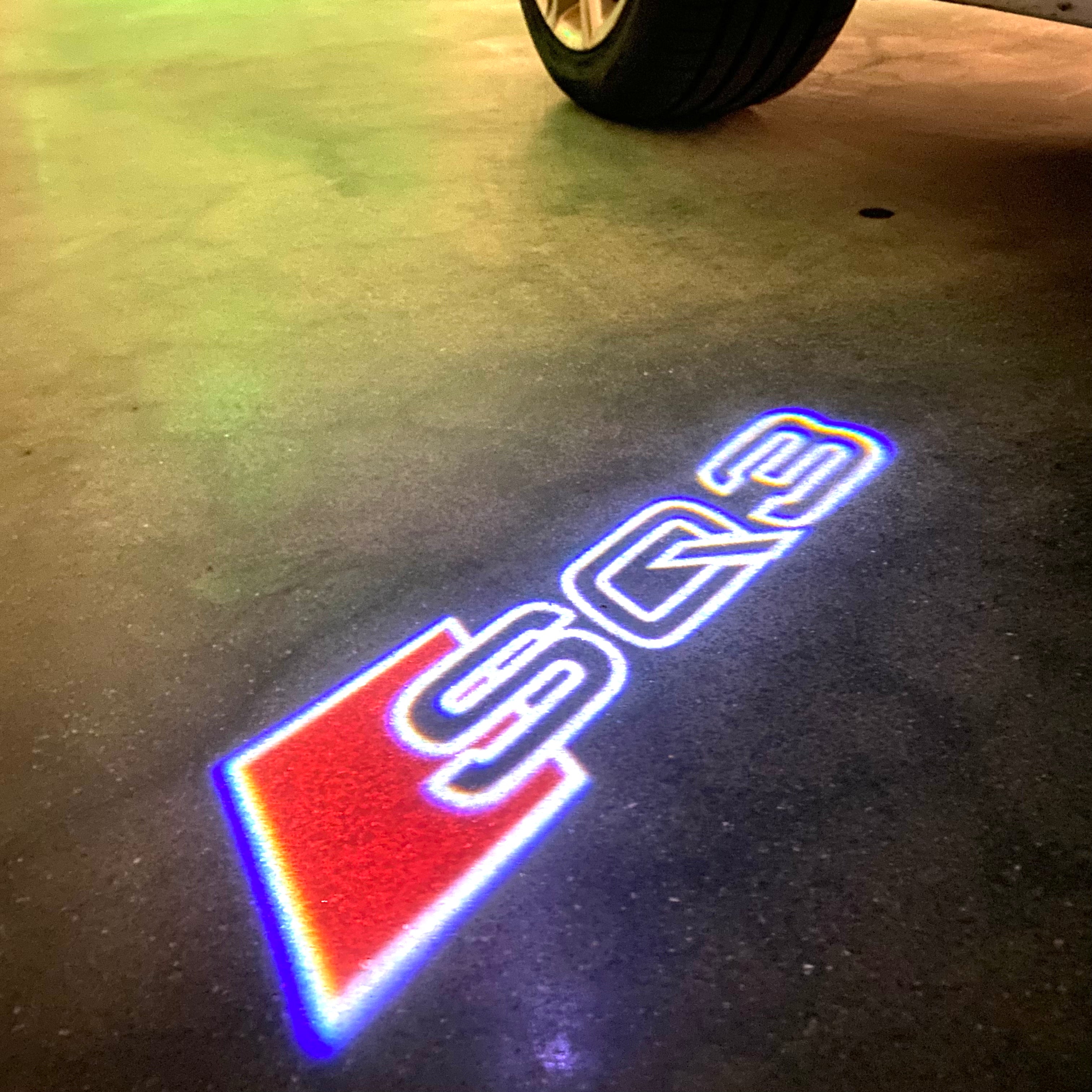 AUDI LOGO PROJECTOT LIGHTS Nr.120 (الكمية 1 = 2 Logo Films /2 أضواء الباب)