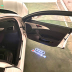 AUDI LOGO PROJECTOT LIGHTS Nr.120 (الكمية 1 = 2 Logo Films /2 أضواء الباب)