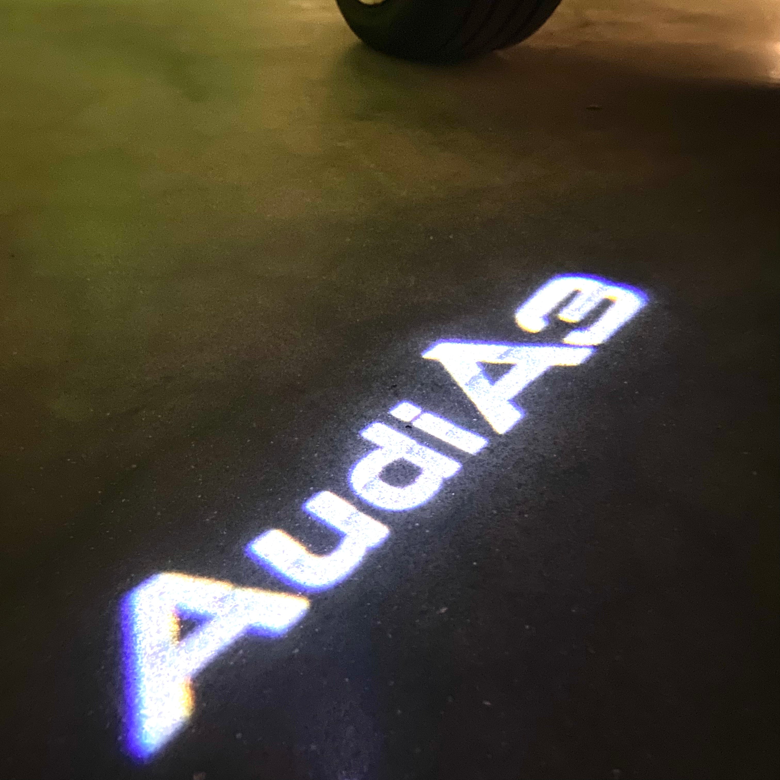 AUDI LOGO PROJECTOT LIGHTS Nr.120 (الكمية 1 = 2 Logo Films /2 أضواء الباب)