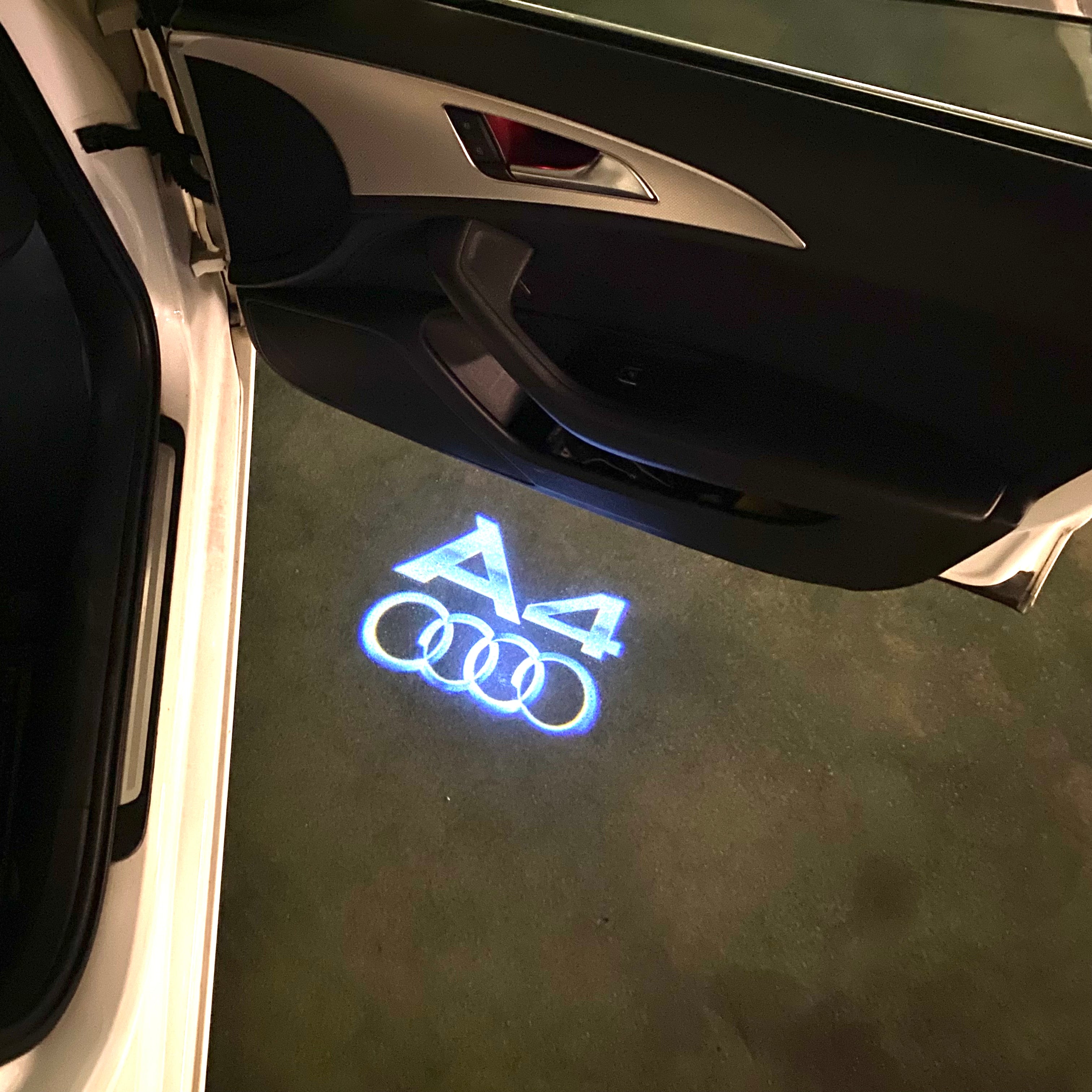 AUDI LOGO PROJECTOT LIGHTS Nr.120 (الكمية 1 = 2 Logo Films /2 أضواء الباب)