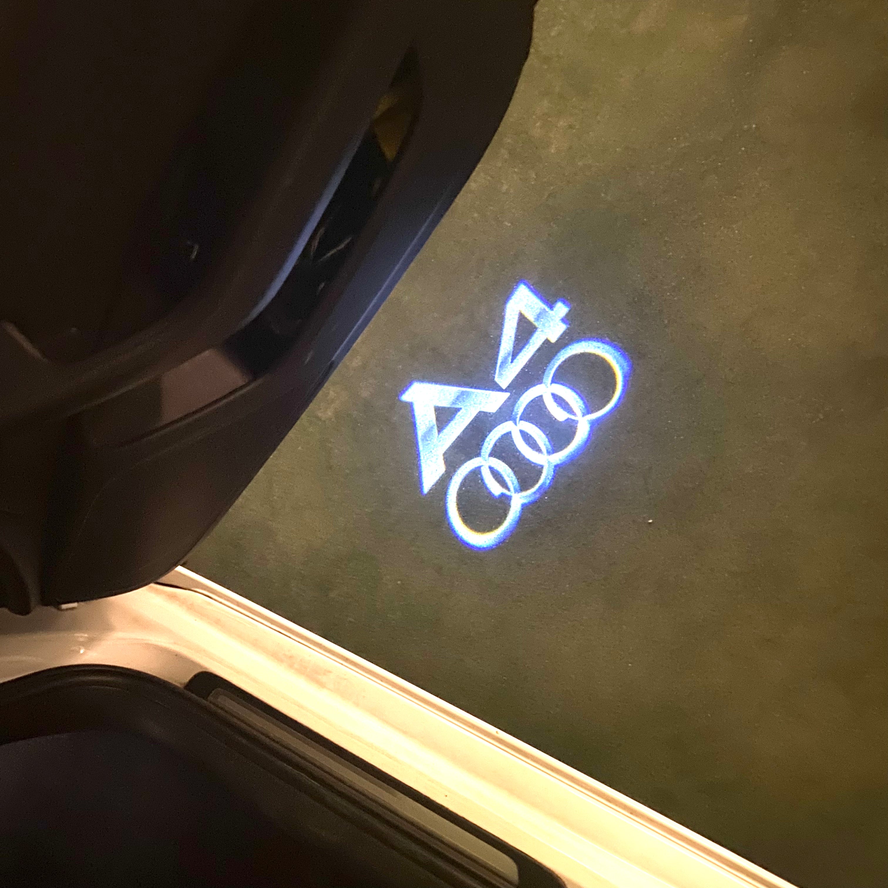 AUDI LOGO PROJECTOT LIGHTS Nr.120 (الكمية 1 = 2 Logo Films /2 أضواء الباب)