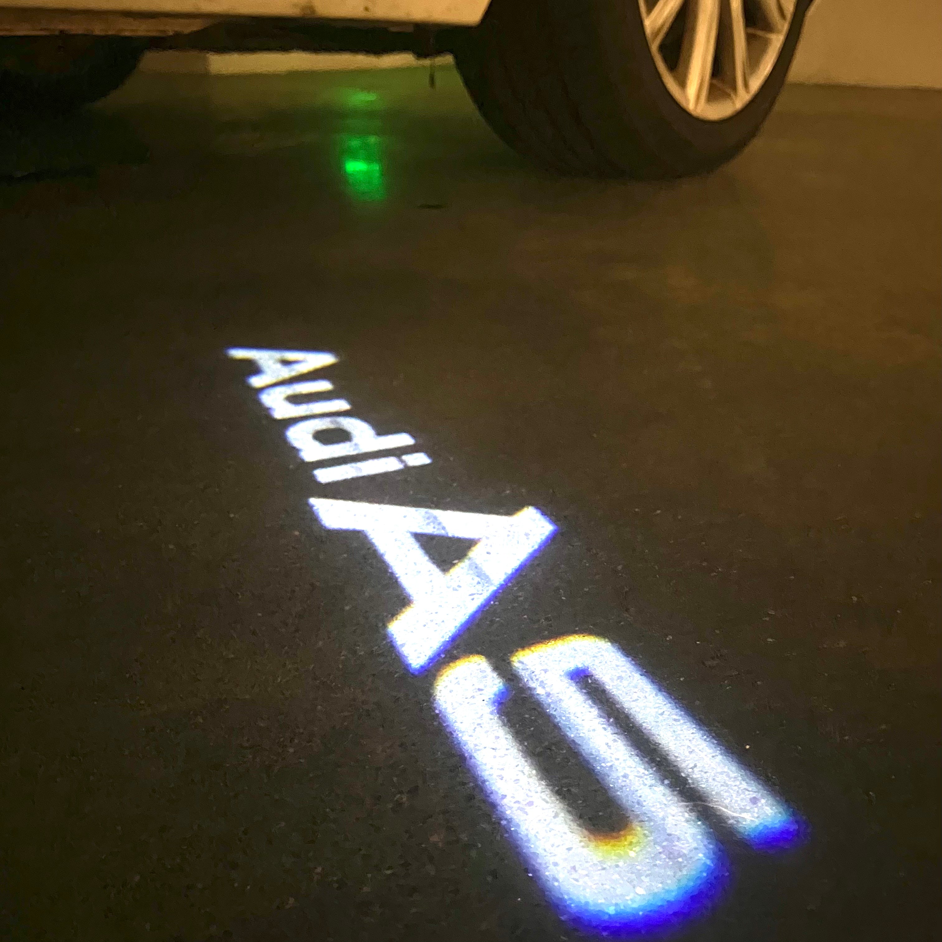 AUDI LOGO PROJECTOT LIGHTS Nr.120 (الكمية 1 = 2 Logo Films /2 أضواء الباب)