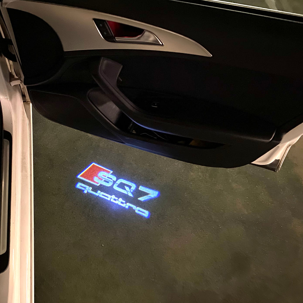 LUCES DE PROYECTOR LOGO AUDI No 120 (cantidad 1 = 2 películas con logotipo / 2 luces de puerta)