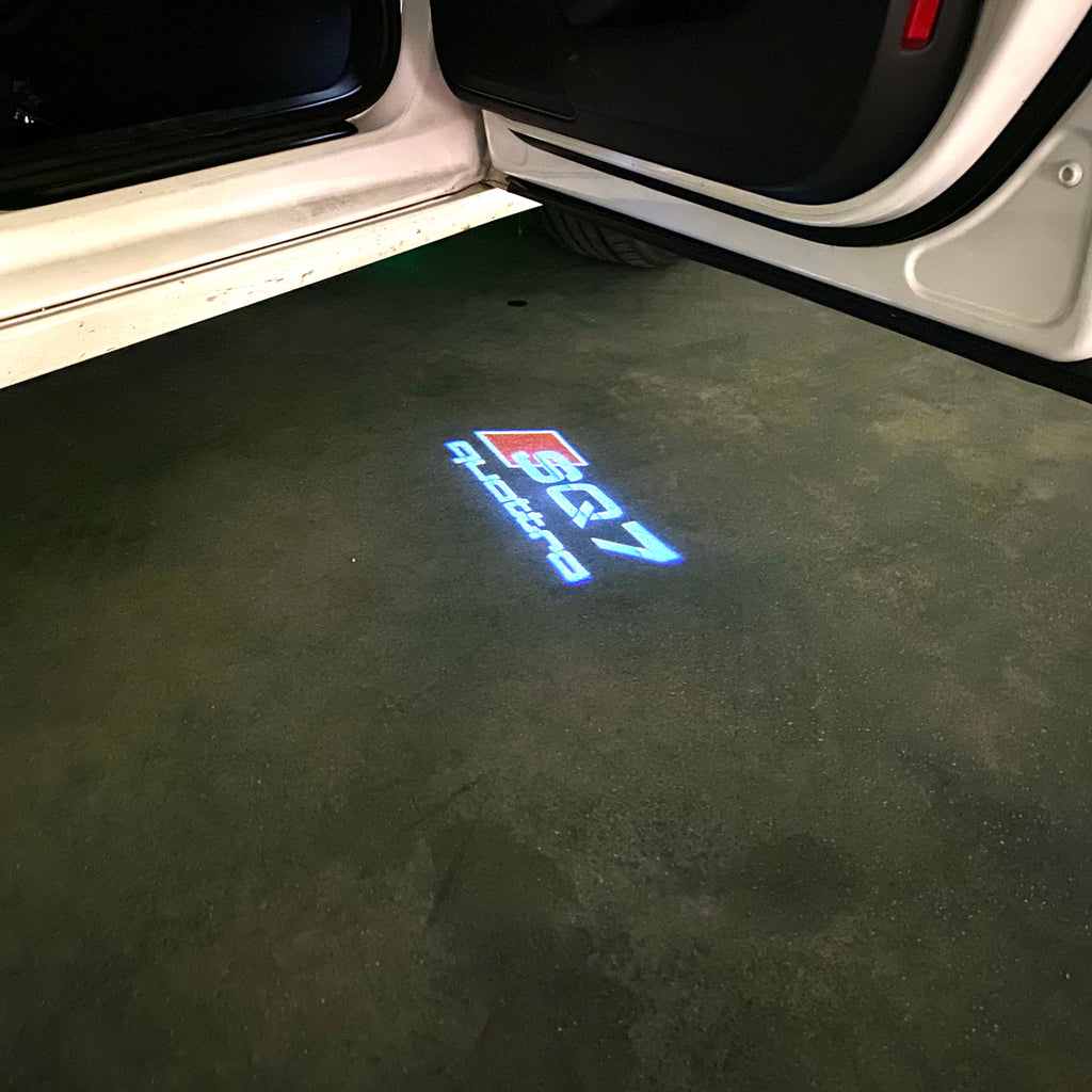 LUCES DE PROYECTOR LOGO AUDI No 120 (cantidad 1 = 2 películas con logotipo / 2 luces de puerta)