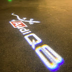 LUCES DE PROYECTOR LOGO AUDI No 120 (cantidad 1 = 2 películas con logotipo / 2 luces de puerta)