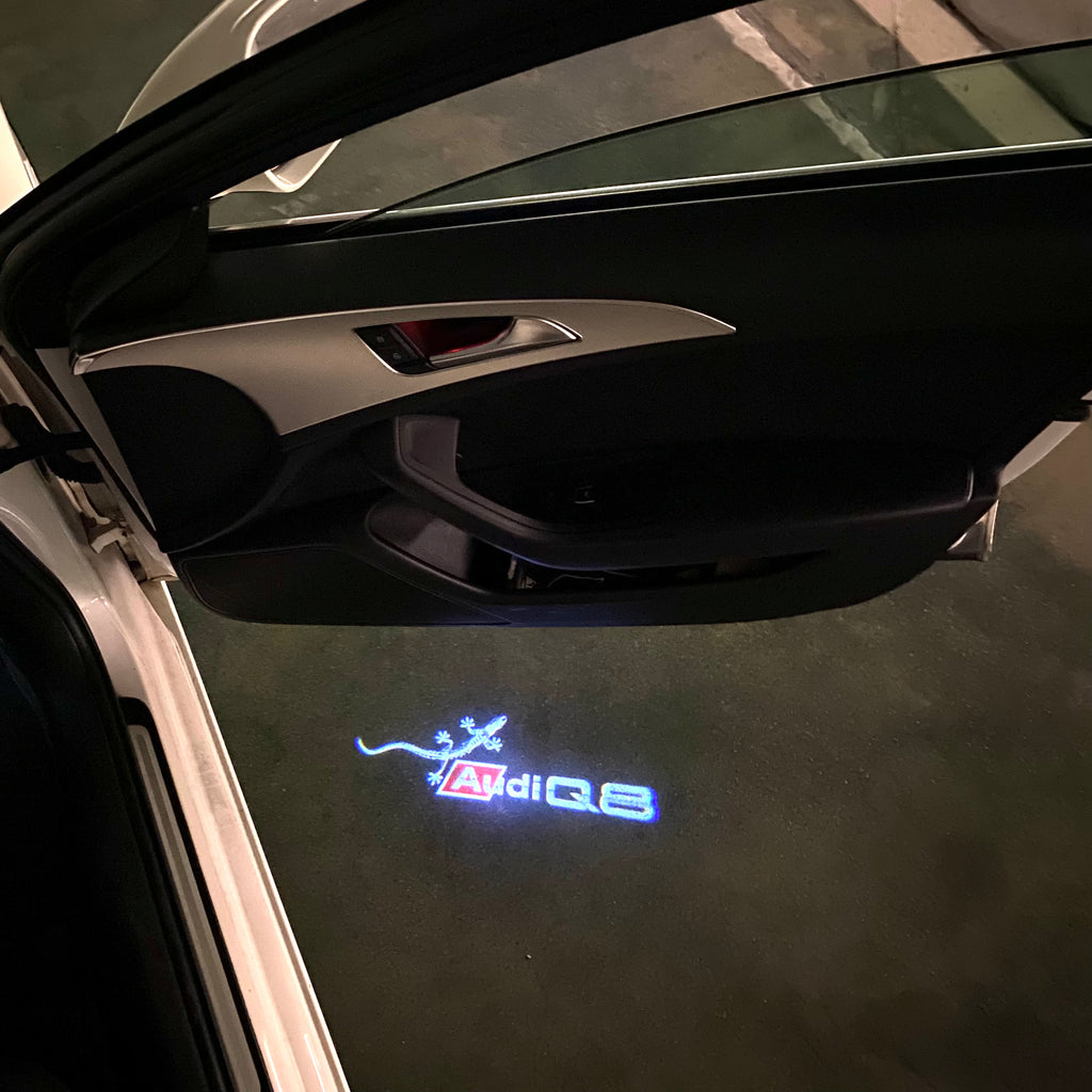 LUCES DE PROYECTOR LOGO AUDI No 120 (cantidad 1 = 2 películas con logotipo / 2 luces de puerta)