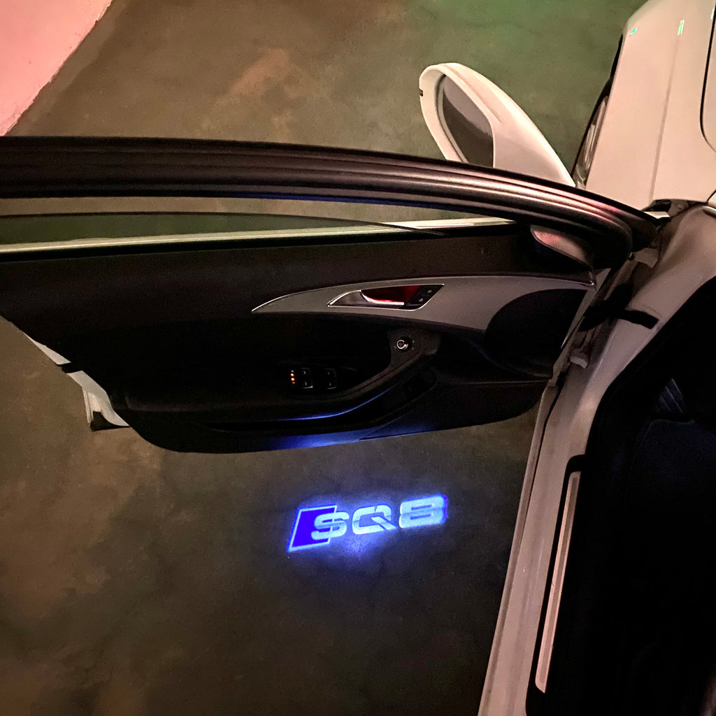 AUDI LOGO PROJECTOT LIGHTS Nr.120 (الكمية 1 = 2 Logo Films /2 أضواء الباب)