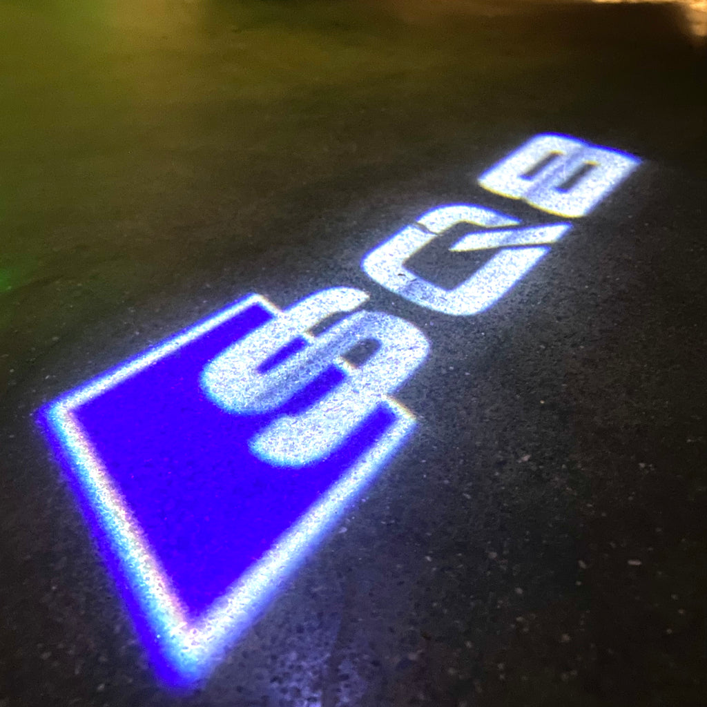 AUDI LOGO PROJECTOT LIGHTS Nr.120 (الكمية 1 = 2 Logo Films /2 أضواء الباب)