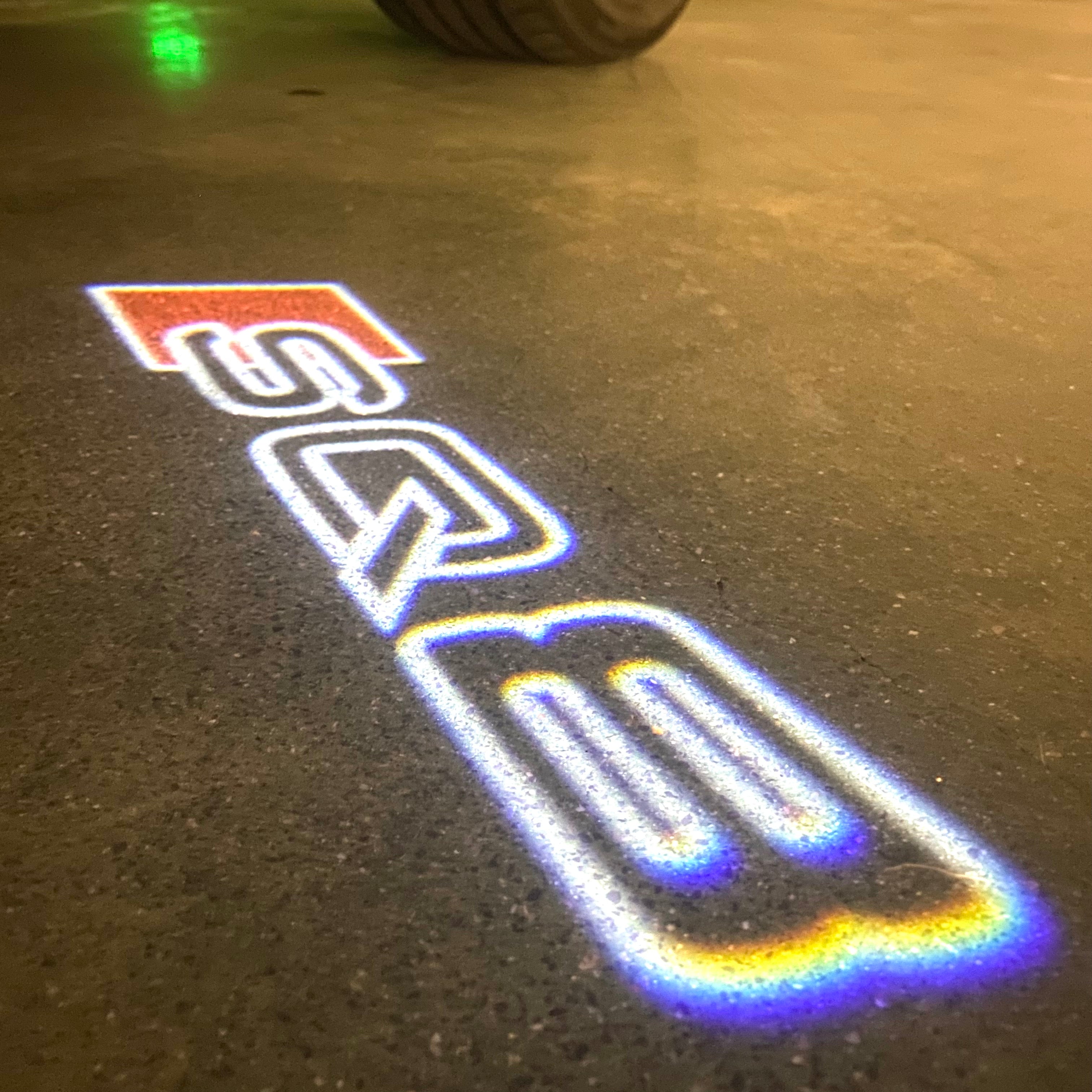 AUDI LOGO PROJECTOT LIGHTS Nr.120 (الكمية 1 = 2 Logo Films /2 أضواء الباب)