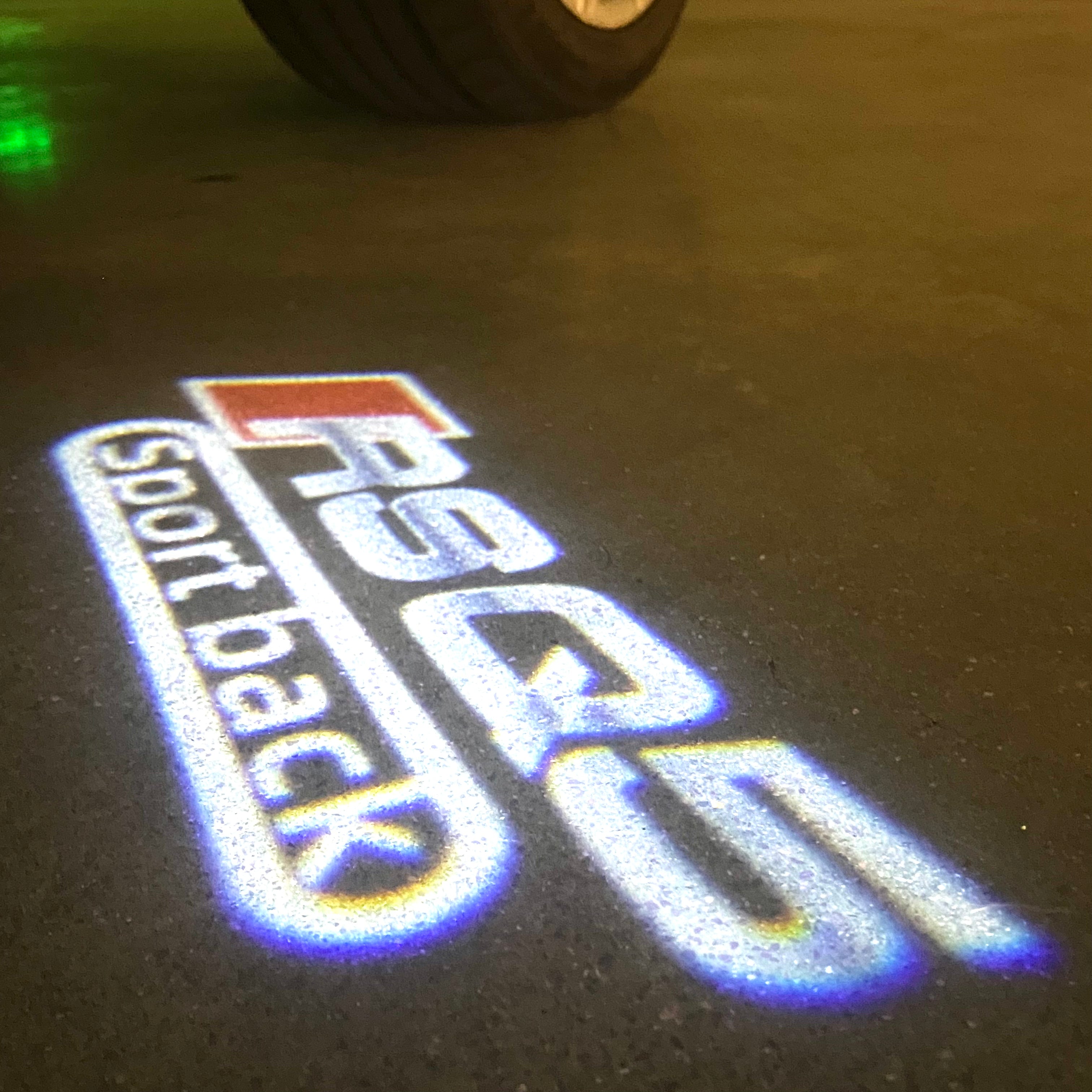 AUDI LOGO PROJECTOT LIGHTS Nr.120 (الكمية 1 = 2 Logo Films /2 أضواء الباب)
