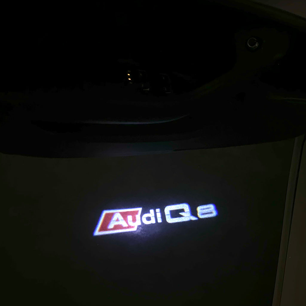 LUCES DE PROYECTOR LOGO AUDI No 120 (cantidad 1 = 2 películas con logotipo / 2 luces de puerta)