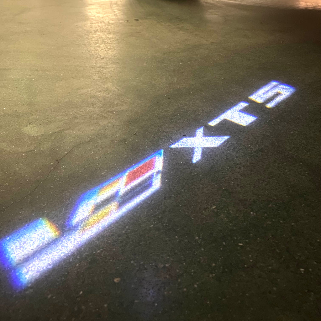 AUDI LOGO PROJECTOT LIGHTS Nr.19 (الكمية 1 = 2 Logo Films /2 أضواء الباب)