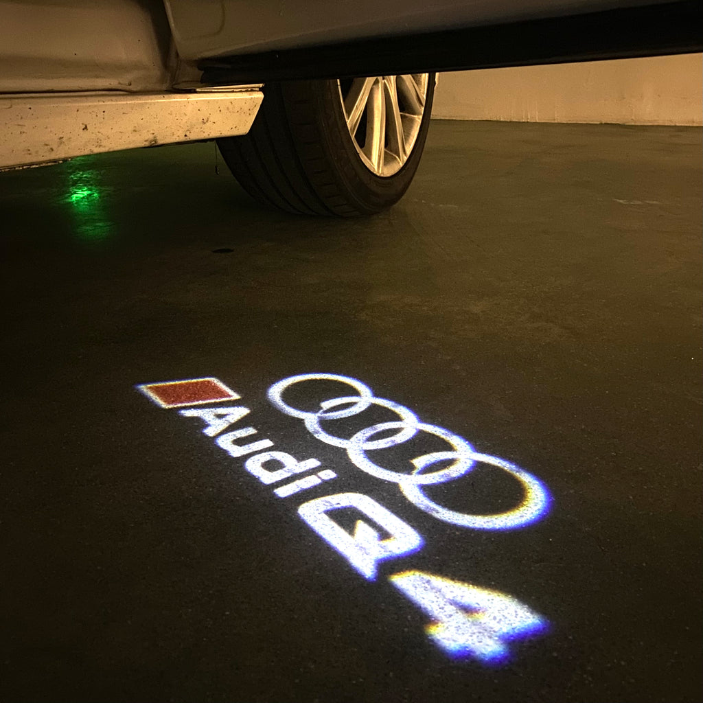 AUDI LOGO PROJECTOT LIGHTS Nr.120 (الكمية 1 = 2 Logo Films /2 أضواء الباب)