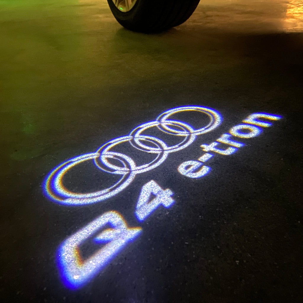 LUCES DE PROYECTOR LOGO AUDI No 120 (cantidad 1 = 2 películas con logotipo / 2 luces de puerta)