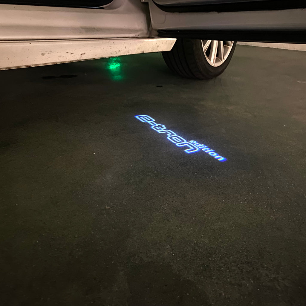 AUDI LOGO PROJECTOT LIGHTS Nr.19 (الكمية 1 = 2 Logo Films /2 أضواء الباب)