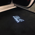 LUCES DE PROYECTOR LOGO AUDI No 120 (cantidad 1 = 2 películas con logotipo / 2 luces de puerta)
