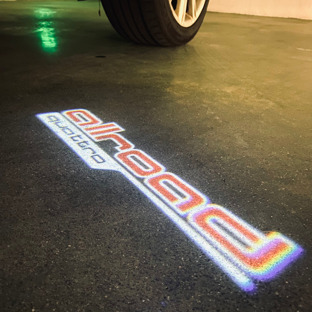 AUDI LOGO PROJECTOT LIGHTS Nr.297 (الكمية 1 = 2 Logo Films /2 أضواء الباب)