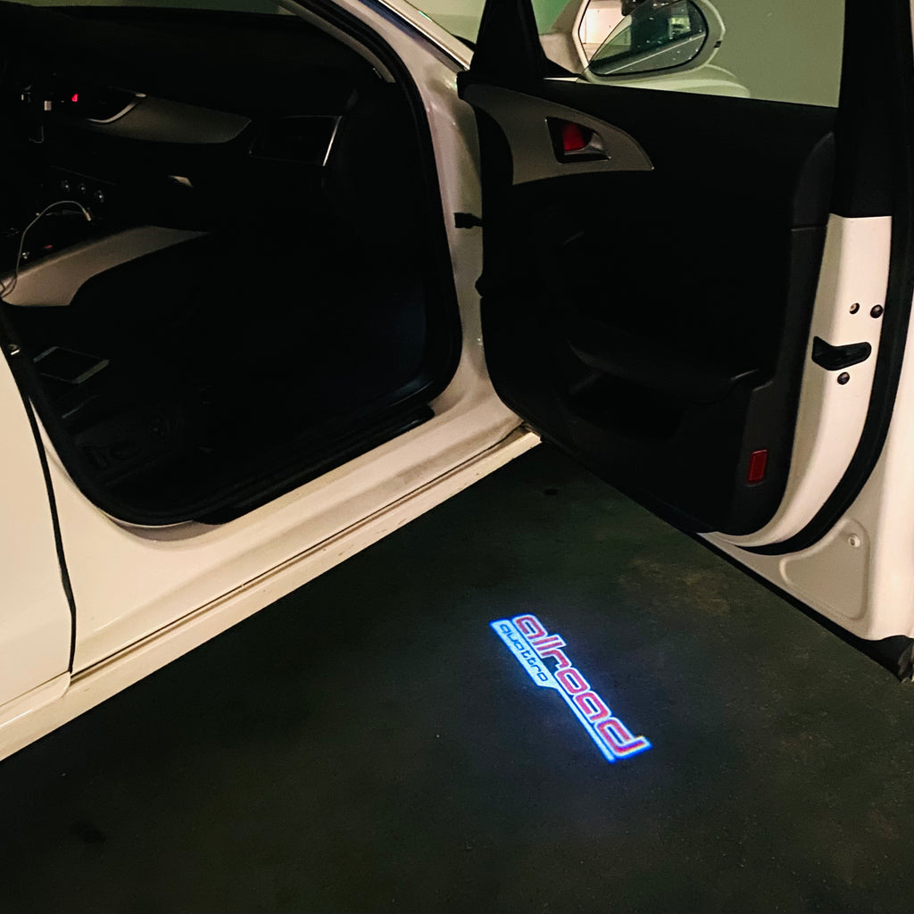 AUDI LOGO PROJECTOT LIGHTS Nr.297 (الكمية 1 = 2 Logo Films /2 أضواء الباب)