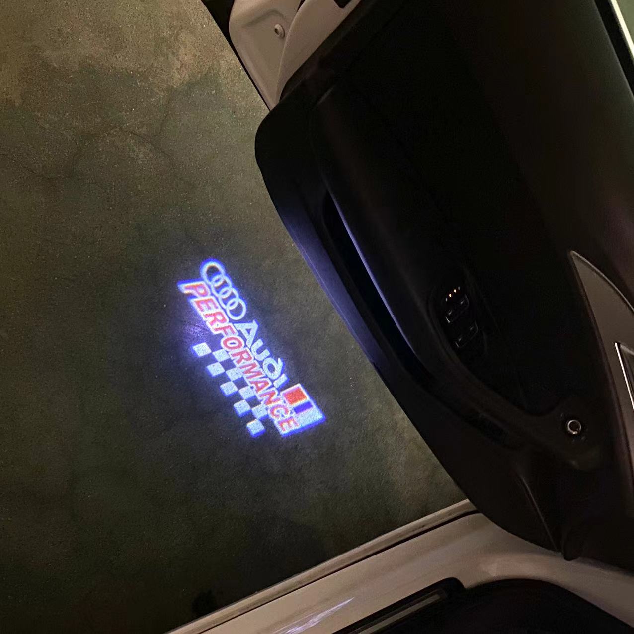 AUDI LOGO PROJECTOT LIGHTS Nr.120 (الكمية 1 = 2 Logo Films /2 أضواء الباب)