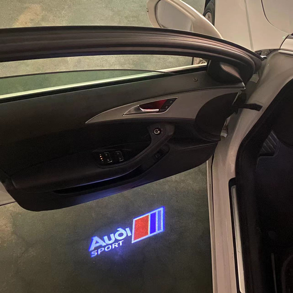 LUCES DE PROYECTOR LOGO AUDI No 120 (cantidad 1 = 2 películas con logotipo / 2 luces de puerta)