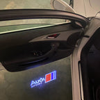 LUCES DE PROYECTOR LOGO AUDI No 120 (cantidad 1 = 2 películas con logotipo / 2 luces de puerta)