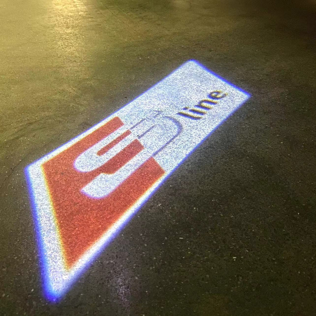 LUCI PROIETTORI LOGO AUDI Nr.109 (quantità 1 = 2 Pellicole Logo / 2 luci porta)