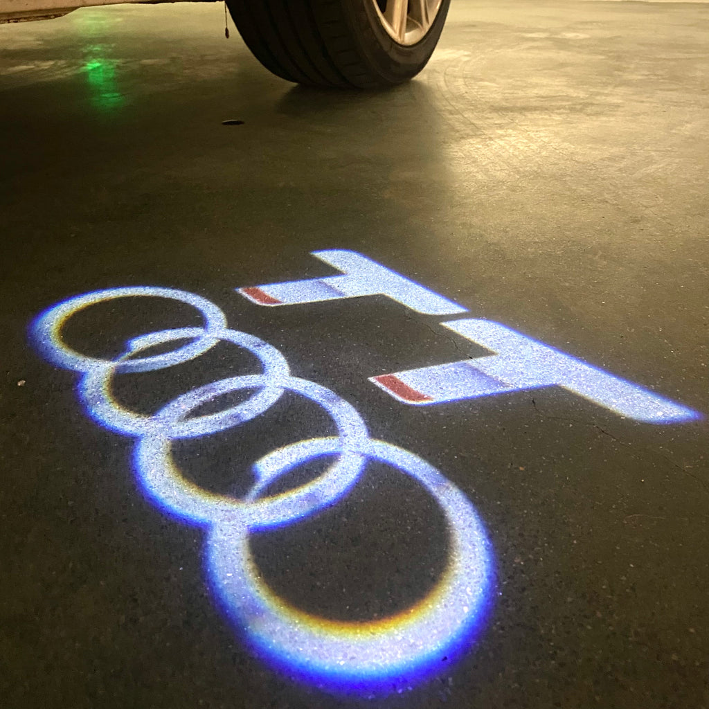 LUCES DE PROYECTOR LOGO AUDI No 120 (cantidad 1 = 2 películas con logotipo / 2 luces de puerta)