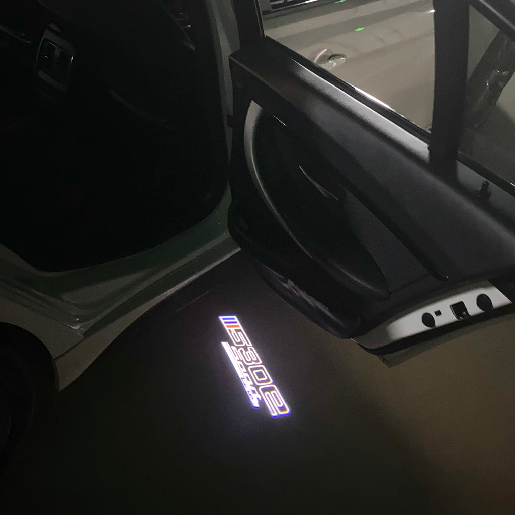 ÉCLAIRAGE DE PROJECTEUR BMW M3 LOGO Nr.24 (quantité 1 = 1 jeux / 2 feux de porte)