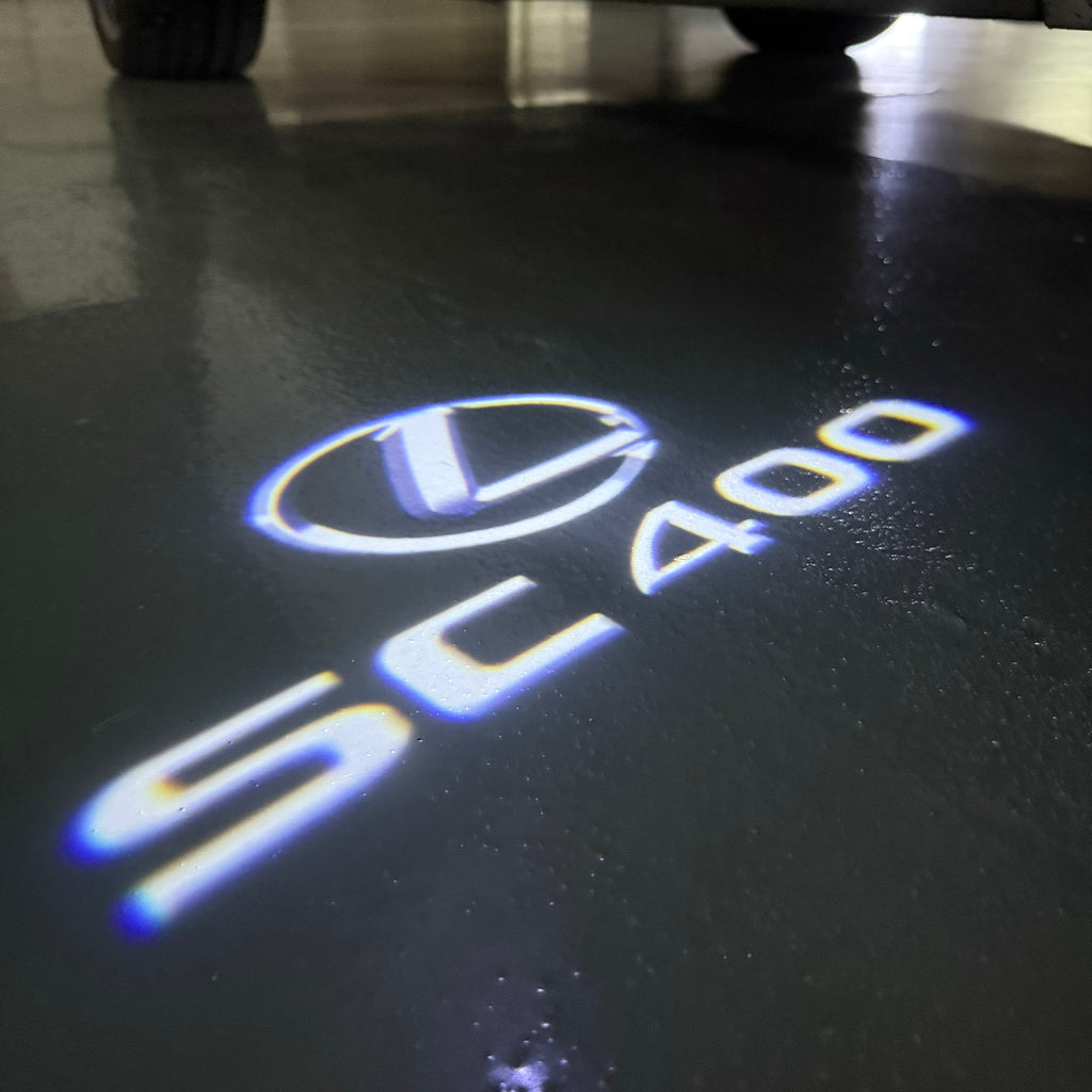 LEXUS LOGO PROJECTOR LIGHTS Nr.01 (الكمية 1 = 1 مجموعة / 2 أضواء باب)