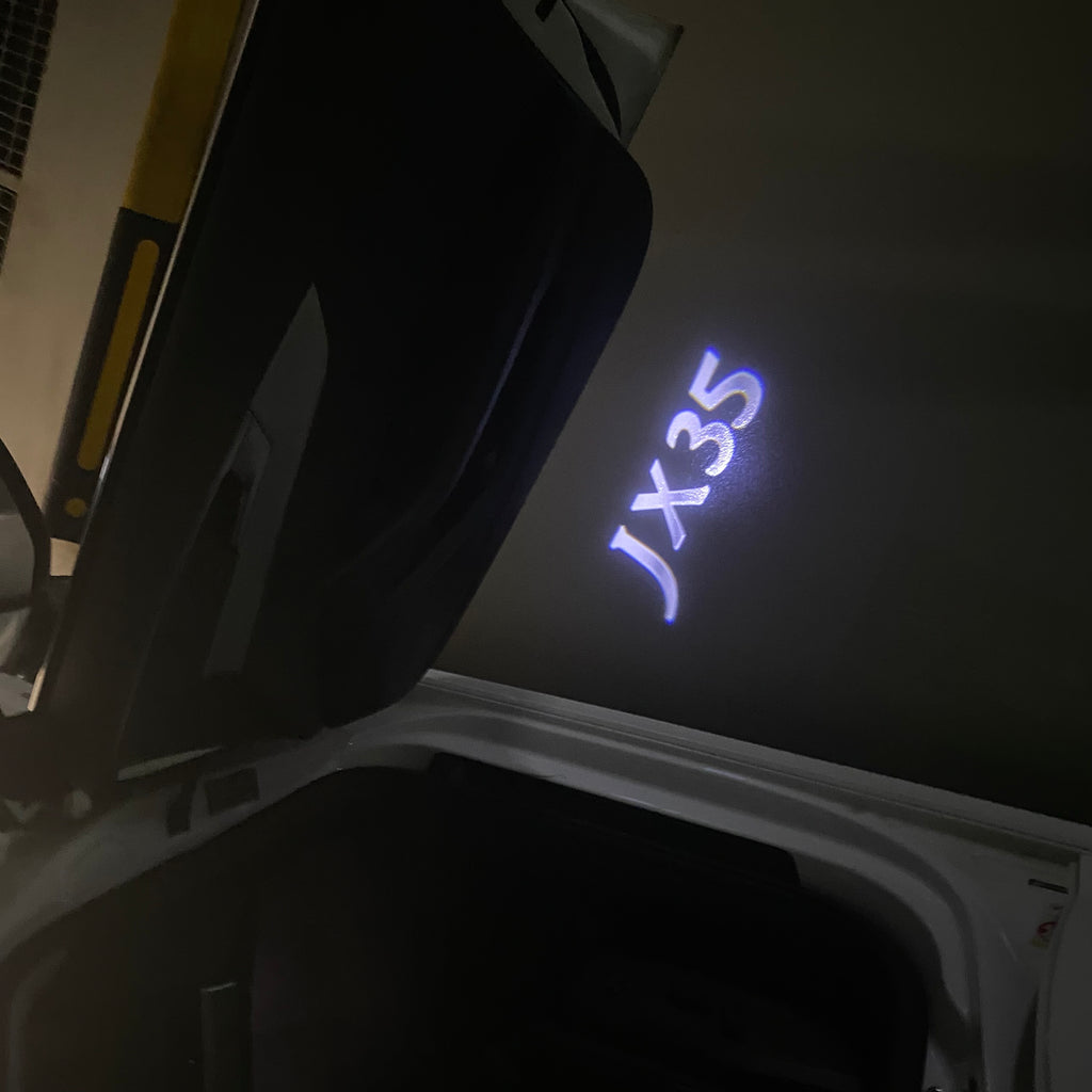 INFINITI JX35 LOGO PROJECTOR LIGHTS Nr.64 (Anzahl 1 = 1 Sätze / 2 Türleuchten)
