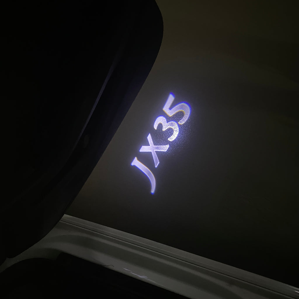 INFINITI JX35 LOGO PROJECTOR LIGHTS Nr.64 (Anzahl 1 = 1 Sätze / 2 Türleuchten)