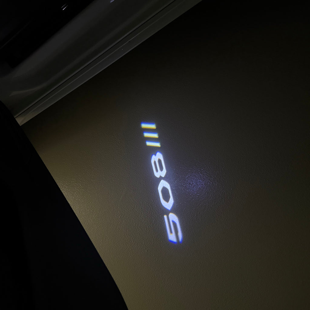 ÉCLAIRAGE DE PROJECTEUR BMW M3 LOGO Nr.24 (quantité 1 = 1 jeux / 2 feux de porte)