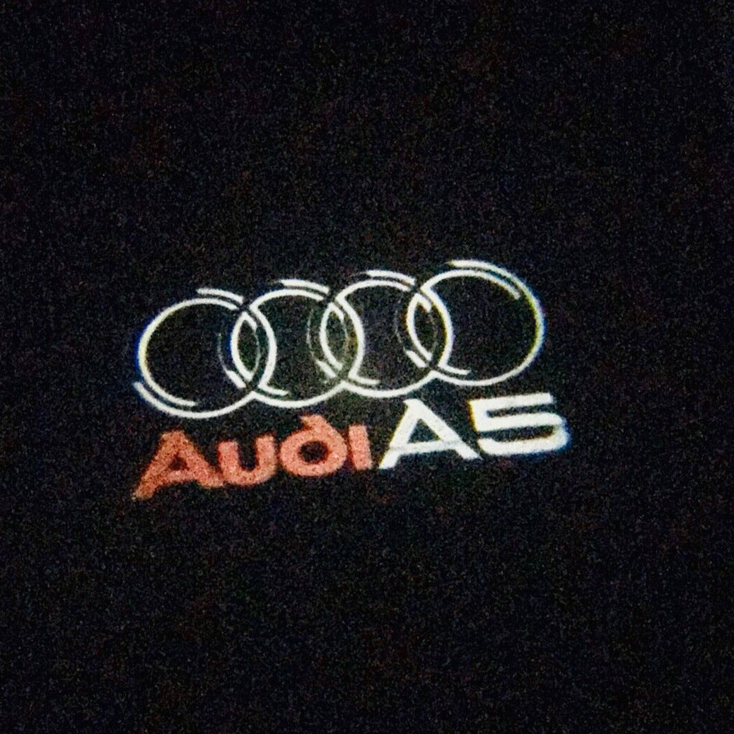 AUDI LOGO PROJECTOT LIGHTS Nr.43 (الكمية 1 = 2 Logo Films /2 أضواء الباب)