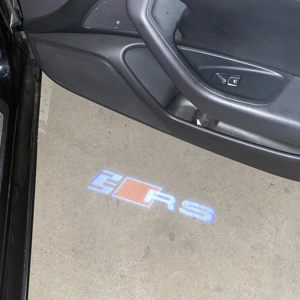 AUDI LOGO PROJECTOT LIGHTS Nr.19 (الكمية 1 = 2 Logo Films /2 أضواء الباب)