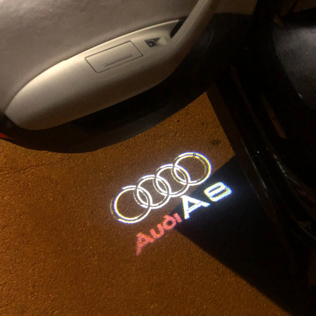 AUDI LOGO PROJECTOT LIGHTS Nr.46 (الكمية 1 = 2 Logo Films /2 أضواء الباب)