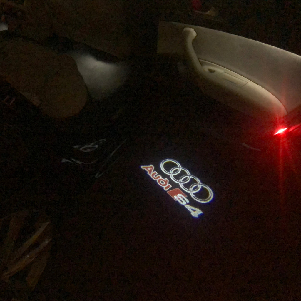 AUDI LOGO PROJECTOT LIGHTS Nr.34 (الكمية 1 = 2 Logo Films /2 أضواء الباب)