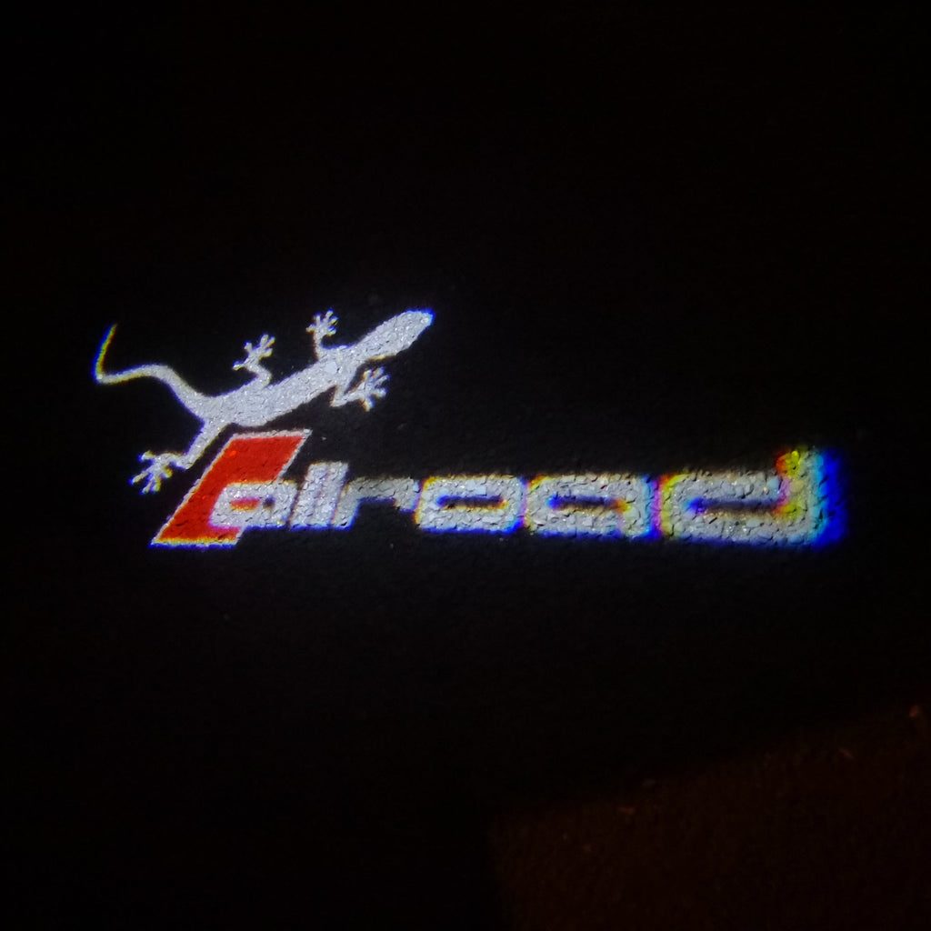 AUDI ALLROAD GECKO LOGO PROJEKTORLEUCHTEN Nr.147 (Anzahl 1 = 2 Logo Folien & 2 Türleuchten)