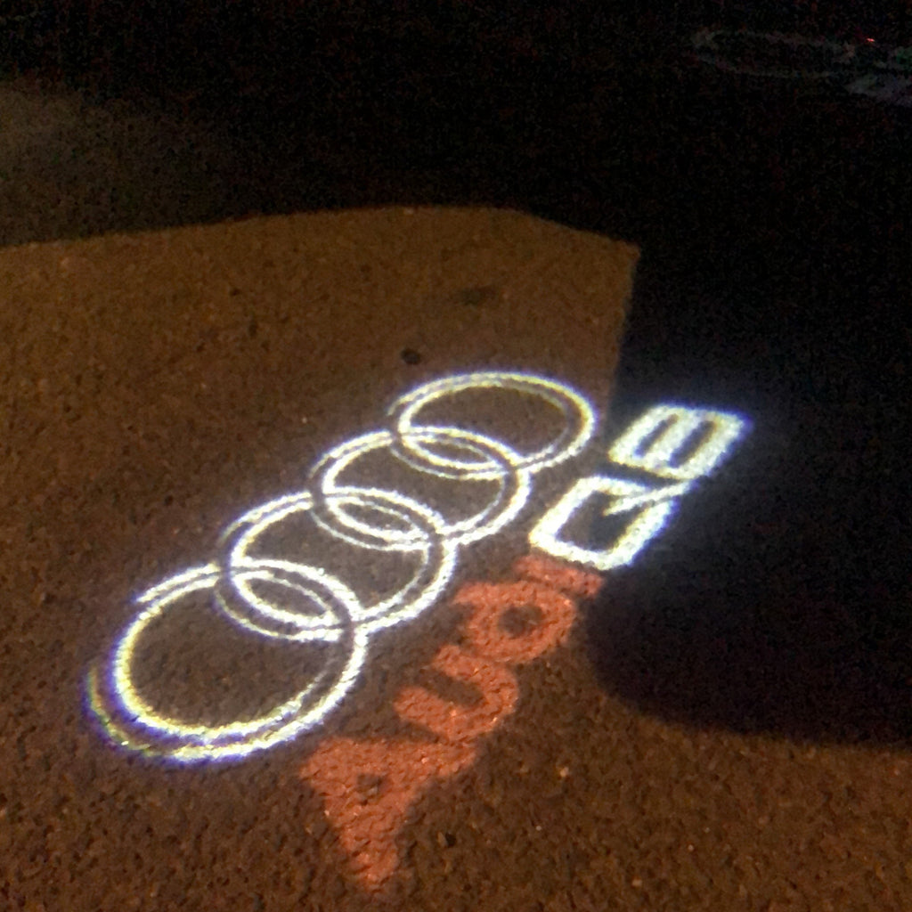AUDI LOGO PROJECTOT LIGHTS Nr.50 (الكمية 1 = 2 Logo Films /2 أضواء الباب)