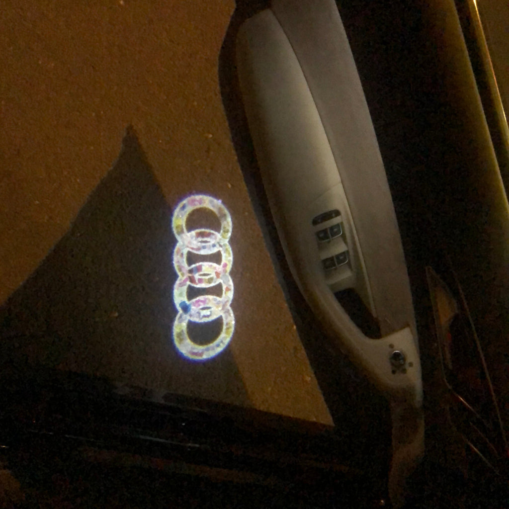 LUCI PROIETTORI LOGO AUDI Nr.10 (quantità 1 = 2 Pellicole Logo / 2 luci porta)