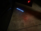 MERCEDES BENZ AMG LOGO PROJECTOT أضواء Nr.13 (كمية 1 = 1 مجموعات / 2 أضواء الباب)