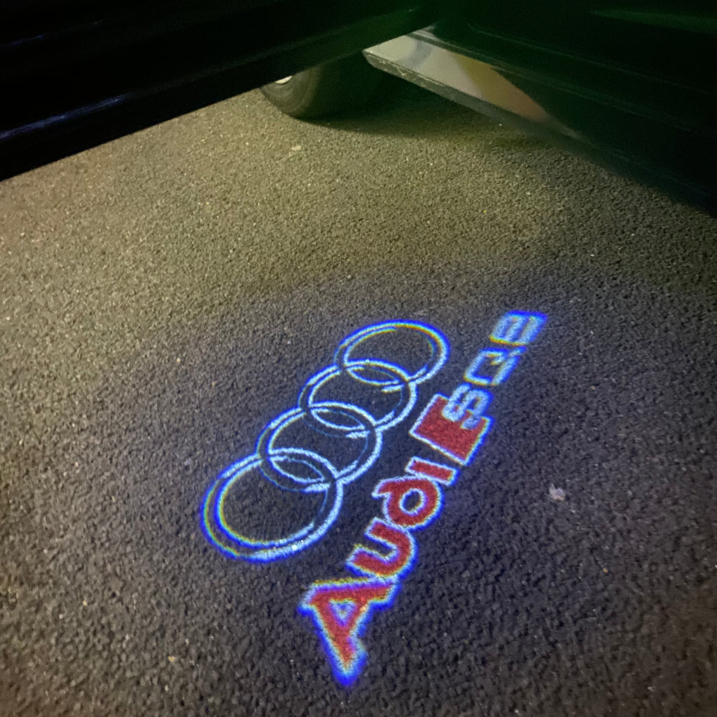 LUCI PROIETTORI LOGO AUDI Nr.255 (quantità 1 = 2 Pellicole Logo / 2 luci porta)