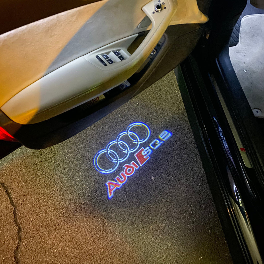 LUCI PROIETTORI LOGO AUDI Nr.255 (quantità 1 = 2 Pellicole Logo / 2 luci porta)