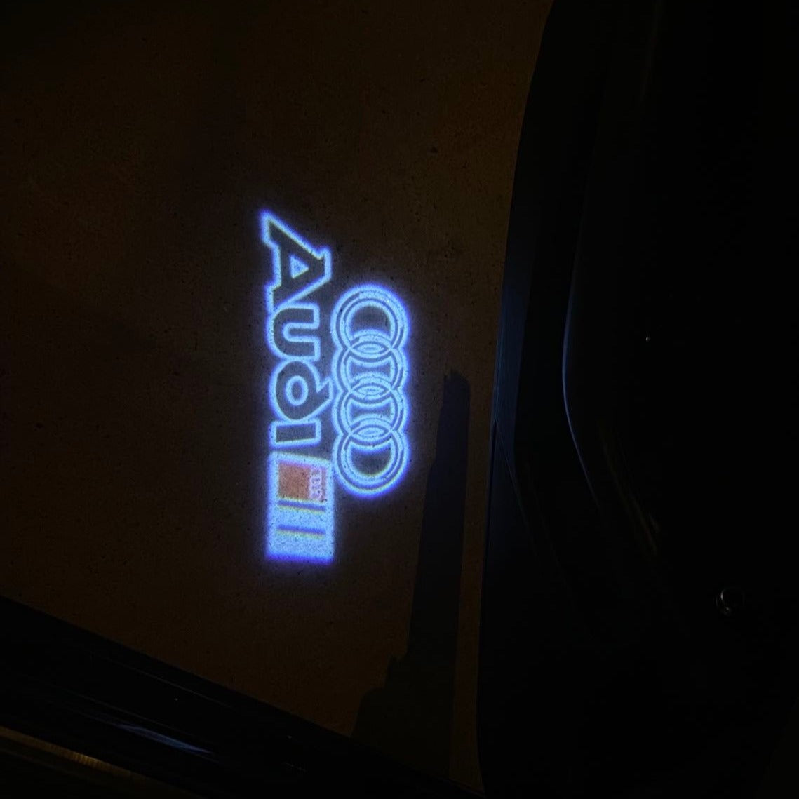 AUDI LOGO PROJECTOT LIGHTS Nr.19 (الكمية 1 = 2 Logo Films /2 أضواء الباب)