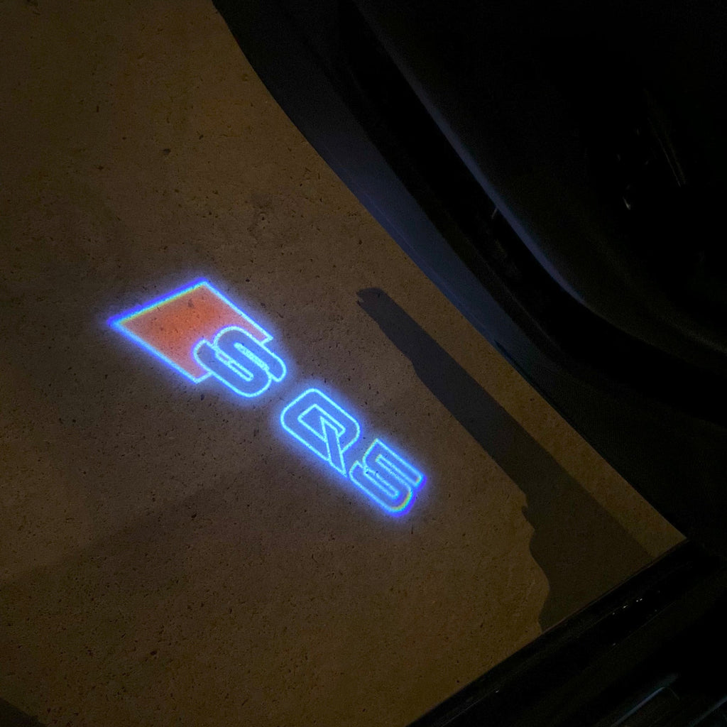 AUDI LOGO PROJECTOT LIGHTS Nr.19 (الكمية 1 = 2 Logo Films /2 أضواء الباب)