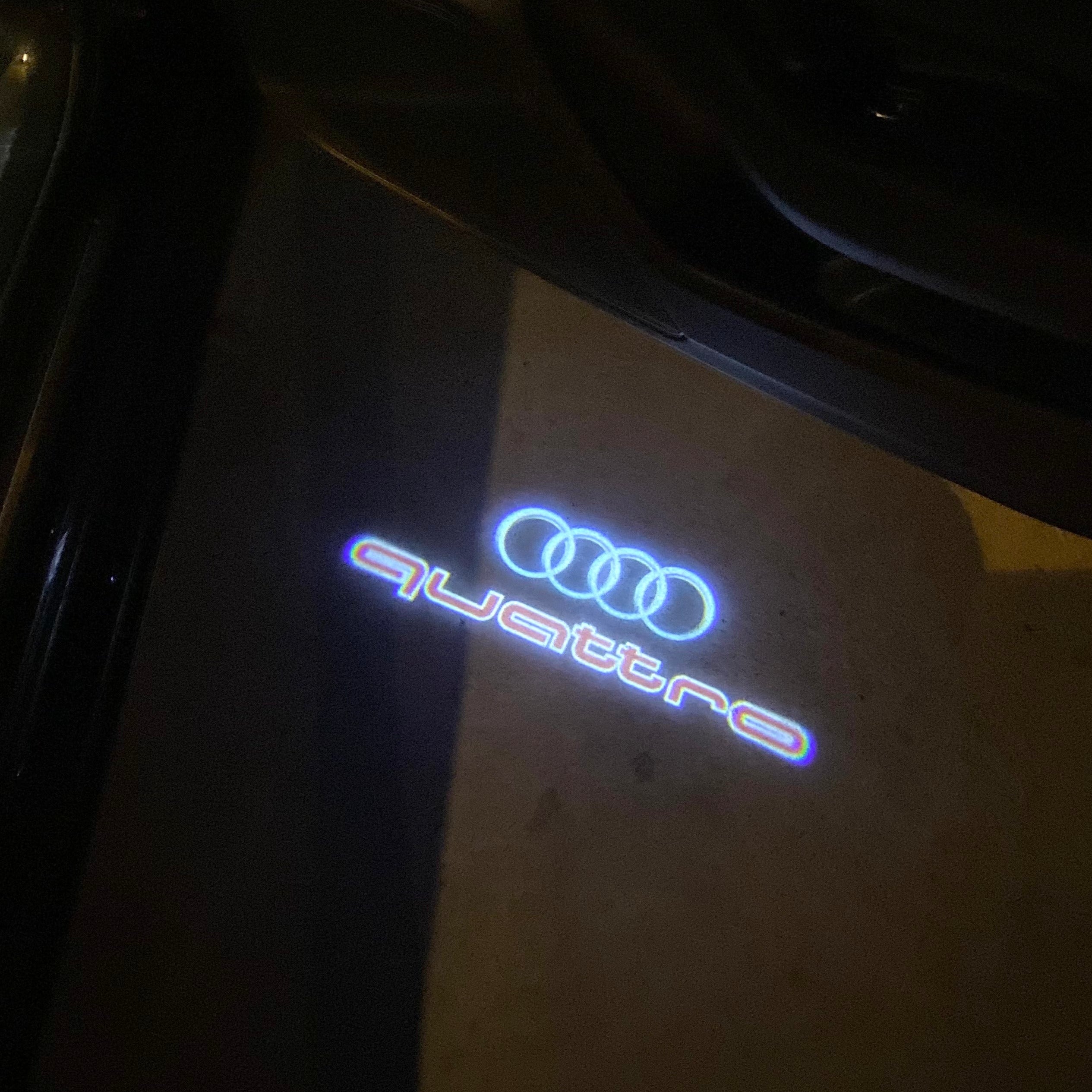 AUDI LOGO PROJECTOT LIGHTS Nr.19 (الكمية 1 = 2 Logo Films /2 أضواء الباب)
