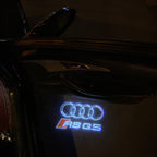 AUDI LOGO PROJECTOT LIGHTS Nr.19 (الكمية 1 = 2 Logo Films /2 أضواء الباب)
