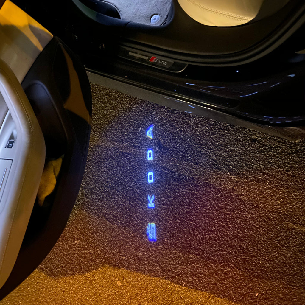 LUCES DE PROYECTOR CON LOGO SKODA Nr.19 (cantidad 1 = 2 películas con logotipo / 2 luces de puerta)